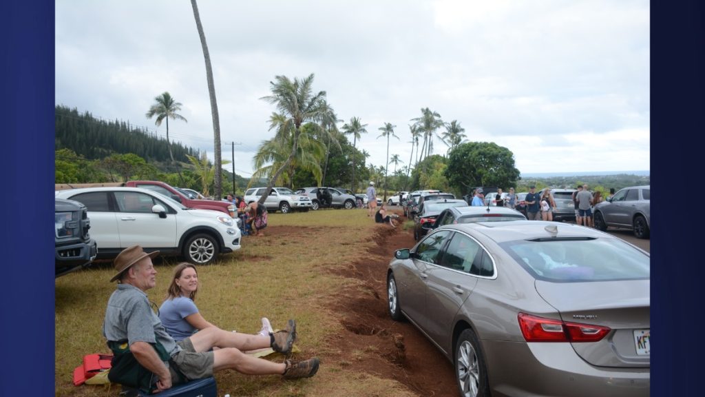 Bottom left: Visitors Leann and Greg Cahall from Missouri sat at Poli'ahu Heiau, waiting for potential tsunami waves alongside other visitors from Hawaii and the mainland on July 29, 2025. (Picture Courtesy: Xiomara Yamileth/ Kaua'i Now)