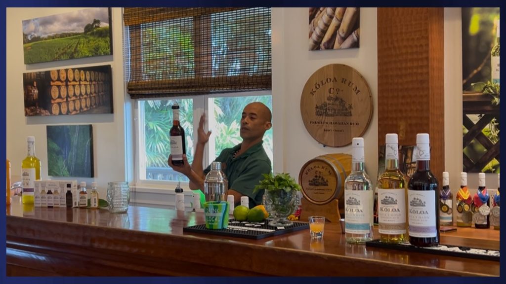 Bartender Randy Toki introduces a lineup featuring various Kōloa Rum products that can be used for cooking, making cocktails, or giving as gifts. (Photo Credit: Xiomara Yamileth/ Kaua'i Now)