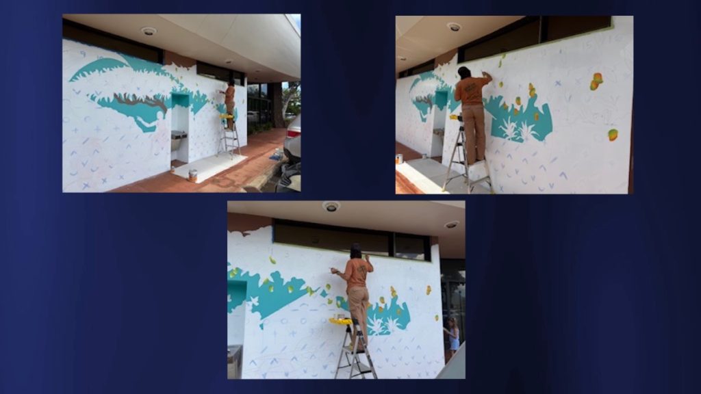 Local artist Holly Ka'iakapu starts painting the new mural at the Līhu'e Library. Her murals are visible all across the Garden Isle. (Photo Credit: Ruda Jordans)