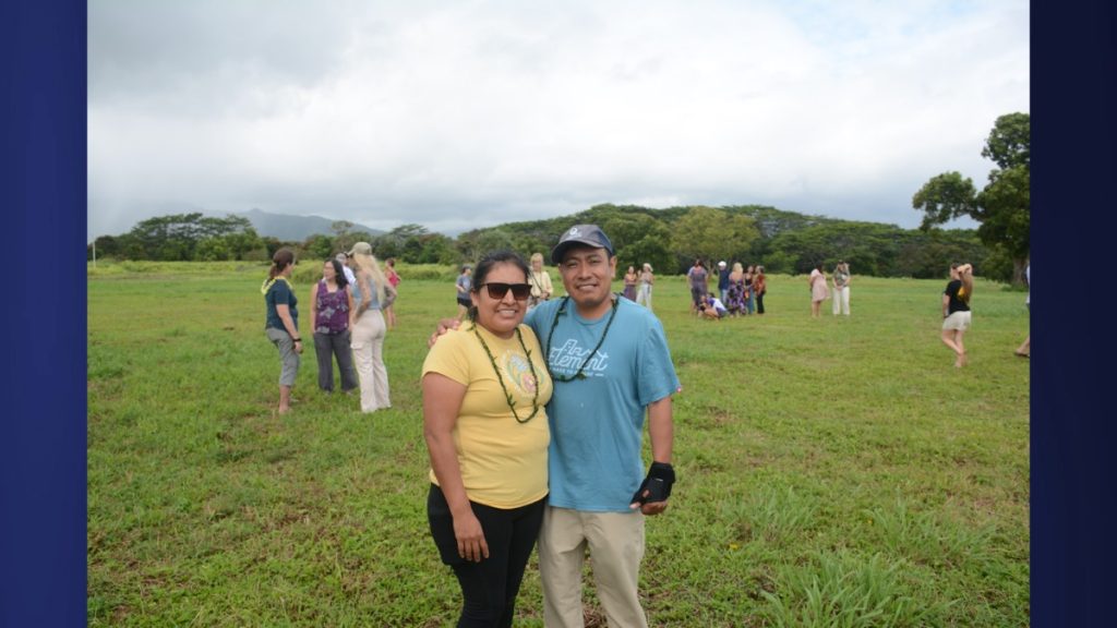 Hanalei residents and parents Alondra and Abraham Varela gathered with the community at Namahana’s permanent campus site for a historic opening day photo. Aug. 4, 2025. (Picture Credit: Xiomara Yamileth/ Kauaʻi Now.)