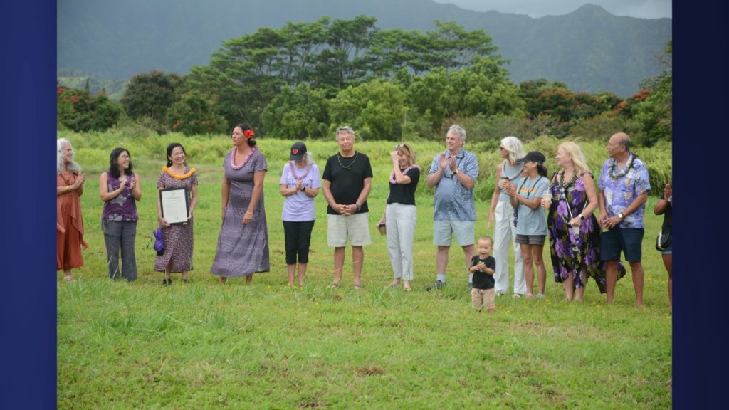 Standing in on behalf of Mayor S.K. Kawakami was Polly Phillips, presenting a proclamation to Namahana at the permanent school site on his behalf after cheering at the Kula campus. Aug. 4, 2025. (Picture Credit: Xiomara Yamileth/ Kauaʻi Now)