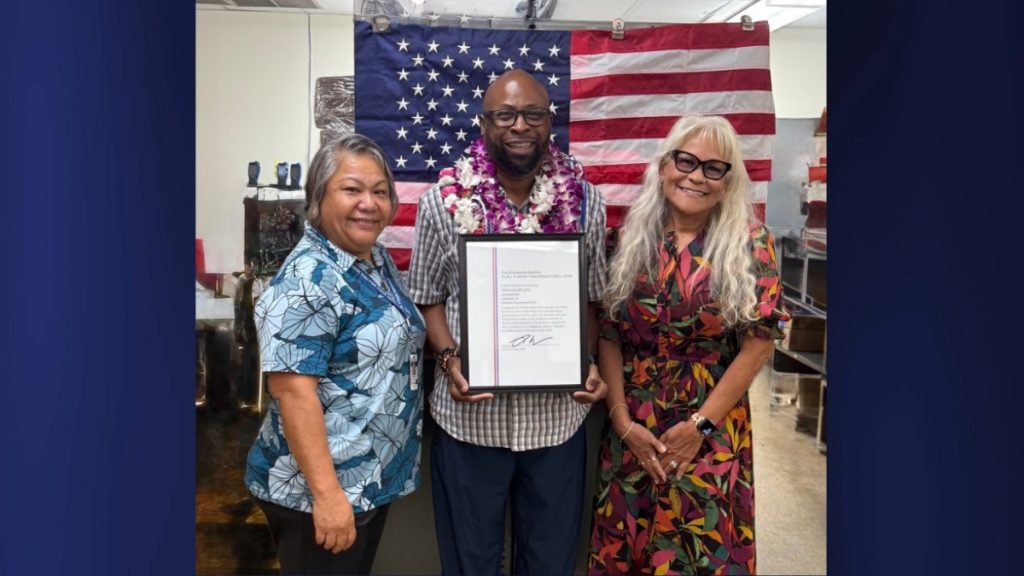 Kalaheo Postmaster David Gillespie (center) with acting Manager Post Office Operations Laroma Parker and Hawai'i District Manager Eileen Veach. (Photo Credit: USPS)
