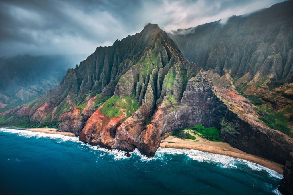 Caption: The jagged cliffs and misty valleys of the Nāpali Coast have inspired centuries of Hawaiian mo‘olelo—stories that reveal the deep spiritual and cultural connection between people and place.