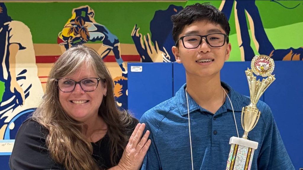Ethan Irimata poses with Hawaiʻi Technology Academy Director of Academics Traci Sullivan after winning the spelling bee competition. (Photo Credit: Hawaiʻi Technology Academy)