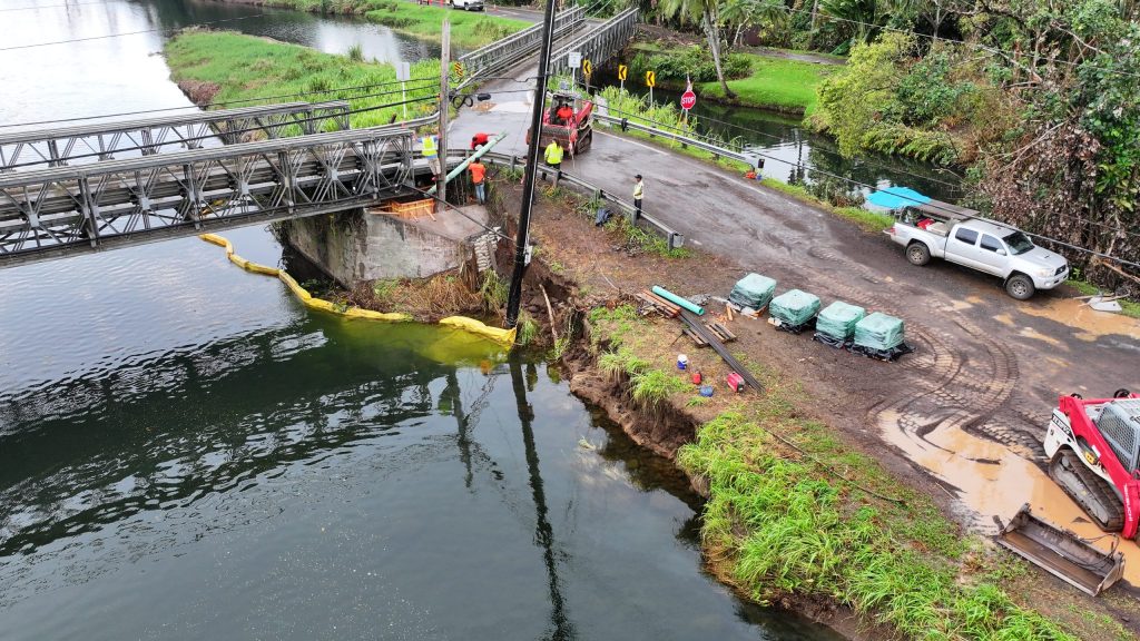 A new abutment is constructed after crews found that earth under the south end of Wainiha River Bridge No 3 was washed out by Hurricane Lowell and the bridge was resting on its concrete wing wall. (Photo Credit: HDOT)
