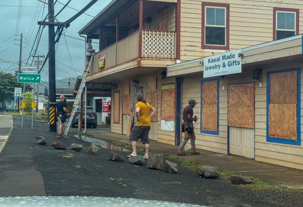Workers boarded up windows at a business in Kapa'a just hours before Hurricane Lowell's arrival on Sept. 7, 2026. (Xiomara Yamileth/ Kauaʻi Now)